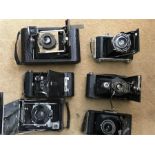 A collection of folding bellows cameras etc including Kodak, Ensign, Eastman Kodak Company, Houstons