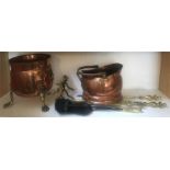 A quanity of brass and copper to include coal scuttle, fire irons, stands etc..