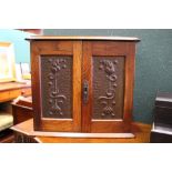 A FINE ART NOUVEAU STYLE SMOKERS CABINET, with metal floral panels to the two doors, the top is