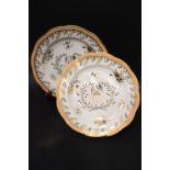 A PAIR OF CHAMBERLAINS' WORCESTER ARMORIAL PLATES, each with floral details and a central painted