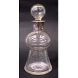 A SILVER COLLARED GLASS DECANTER, with stopper, London, standard sterling silver date 1905/06,