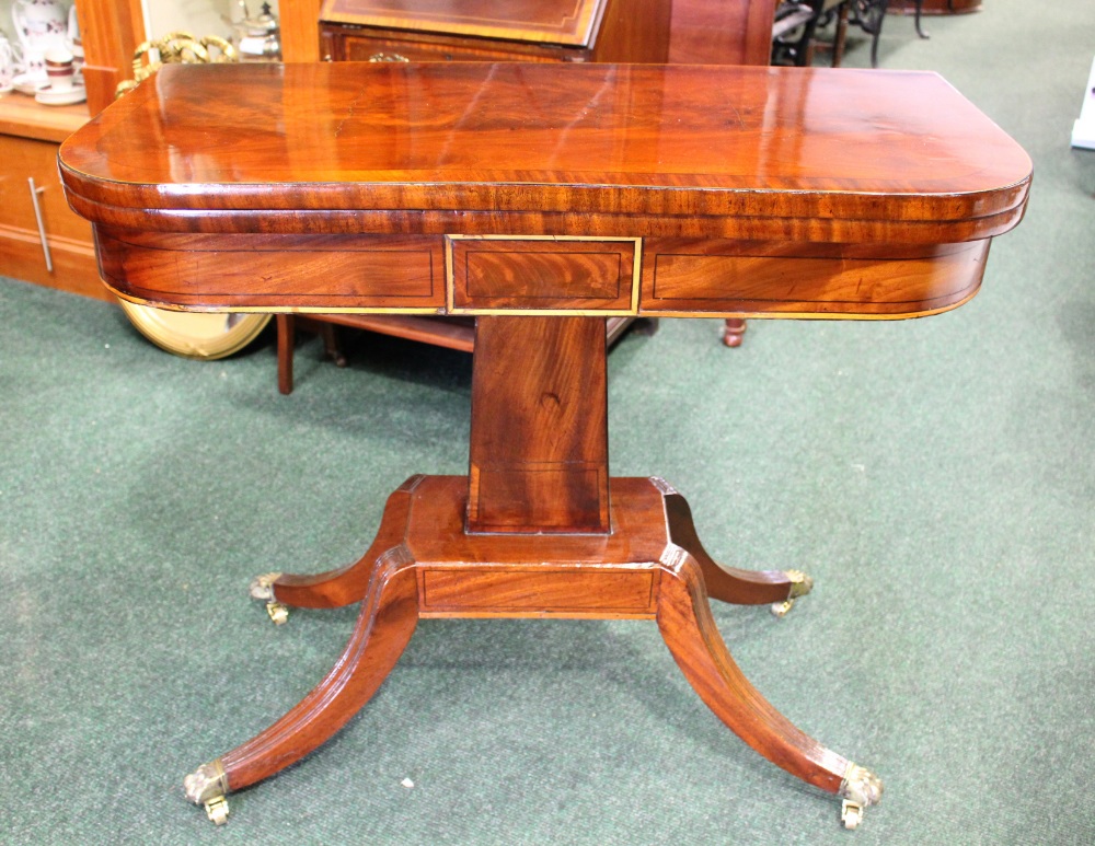 A FINE REGENCY FOLD OVER CARD TABLE, mahogany with satinwood inlaid detailing