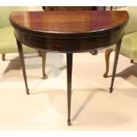A DEMI LUNE FOLD OVER CARD TABLE, with cross banded top, gate leg to the back to support table