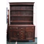 AN 18TH CENTURY WELSH DRESSER, with stepped cavetto cornice over three plate shelves