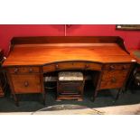 A LARGE SIDE BOARD, decorated with ebonised detail to the front, a single central curved drawer,