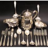 A MIXED SILVER PLATE LOT; includes; (1) Coffee pot, (1) sauce boats, & various pieces of cutlery (