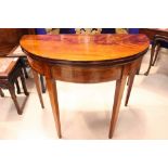 A VERY FINE LATE 18TH CENTURY DEMI LUNE FOLD OVER TEA TABLE, circa 1790, with flame mahogany table