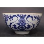 A LATE 19TH CENTURY CHINESE BLUE & WHITE BOWL, painted with stylised floral medallions, the interior