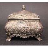 A DUTCH SILVER TRINKET BOX, with gilt interior, the body decorated all over with repoussé effect,
