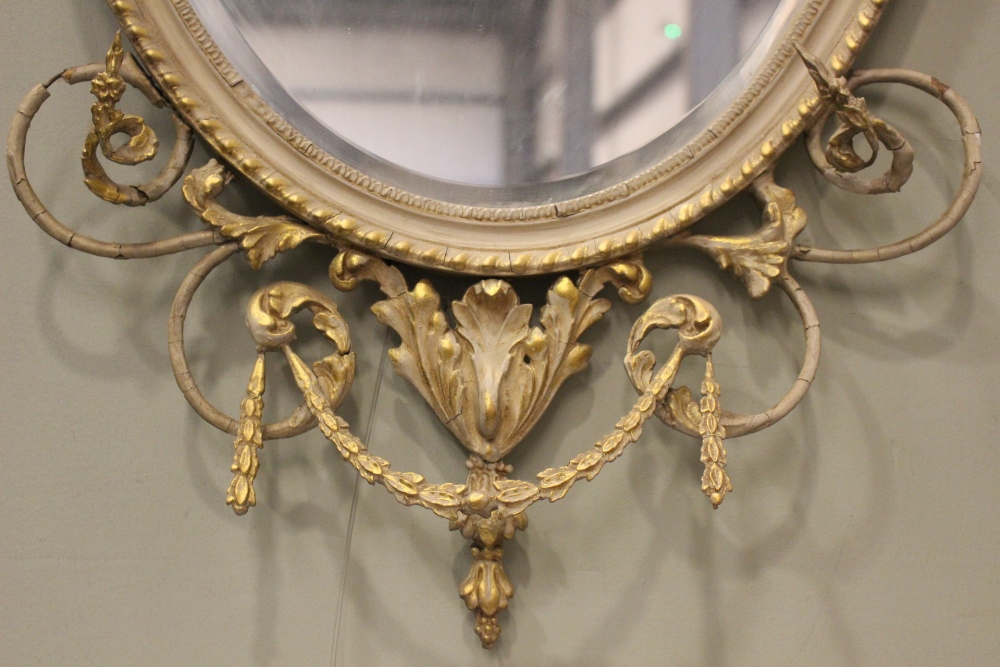 AN OVAL GILT WALL MIRROR, with floral & foliage gesso detailing, bevelled glass - Image 2 of 3