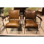 A PAIR OF LEATHER AND METAL ARM CHAIRS, with shaped wooden arm rests