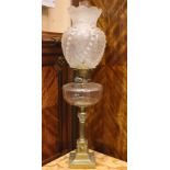 A CORINTHIAN BASED OIL LAMP, with shaped acid etched shade, clear chimney, clear reservoir