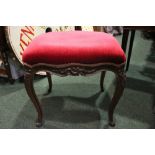 A FRENCH FOOT STOOL, with shaped cabriole leg, having scroll tipped ends