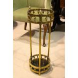 A ROUNDED COLUMNED BRASS UNBRELLA/STICK STAND, with upturned bee hive finials, 26" tall approx, 9"