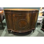 A LARGE MAHOGANY SERPENTINE SHAPED SIDE BOARD/CABINET, with beaded detail to the cabinet door,