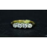 AN 18CT YELLOW GOLD FOUR STONE DIAMOND RING