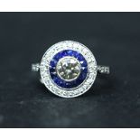 AN 18CT WHITE GOLD SAPPHIRE AND DIAMOND RING, "Target" design