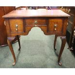 A FINE OAK THREE DRAWER LOWBOY/DESK, with 2 deep drawers flanking a central narrow drawer