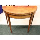 A FINE EDWARDIAN DEMI LUNE FOLD OVER TEA TABLE, cross banded top, string inlaid legs and frieze,