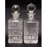 A PAIR OF GLASS SPIRIT DECANTERS, (1) 9.5" tall, with stopper, (1) 10.5" tall, with stopper