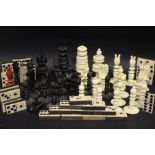 A COLLECTION OF GAMES PIECES, includes chess pieces & domino pieces