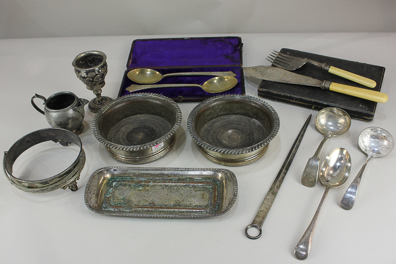 A pair of silver plated bottle coasters, a cased set of spoons, and various other silver plated