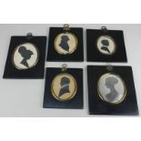 A collection of five oval silhouette profile portraits, to include a young man in frilled collar,