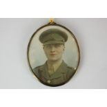 An early 20th century oval miniature portrait of an army officer, on card, 7.5cm by 6.4cm