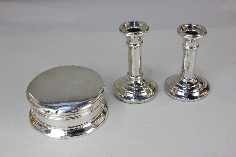 A pair of George VI silver dwarf candlesticks with column stems on circular loaded bases, Birmingham