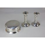 A pair of George VI silver dwarf candlesticks with column stems on circular loaded bases, Birmingham