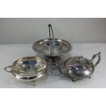 A Victorian silver plated teapot, circular shape with cast floral finial, scroll handle and engraved