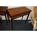 An Edwardian inlaid mahogany card table, rectangular fold-over top with chequer line cross banding