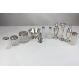 A collection of six various silver topped glass dressing table jars, a pair of sterling silver