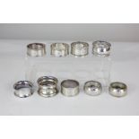 Three pairs and three single silver napkin rings with various engraved initials, 4oz