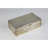 A George V silver rectangular cigarette box with engine turned decoration, lid with engraved