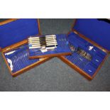 A part canteen of silver plated cutlery in two oak cases