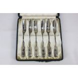 A set of six silver Archibald Knox for Liberty cake forks with Honesty design terminals, in original