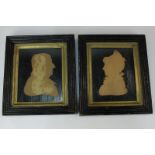 A pair of cut paper silhouette profile portraits, of a gentleman and a lady, inscribed verso Sir