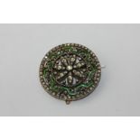 An attractive diamond and enamel brooch pierced shield form set throughout with graduated rose