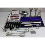 A cased set of six silver plated Coronation tea spoons, a cased set of six soup spoons, a cased