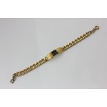 A 9ct gold curb link 'ID' bracelet 38.7g