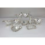 Three various silver plated sauce boats, a sugar caster, toast rack, two-handled dish, cream jug,