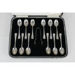 A cased set of twelve George VI silver Hanoverian pattern coffee spoons, and a pair of sugar