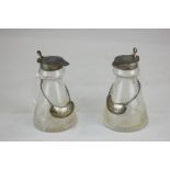 A pair of Edward VIII silver topped glass oil and vinegar jars, maker S Blackensee & Son, Chester