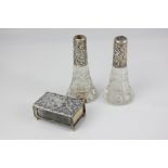 A Victorian silver matchbox cover with embossed scroll decoration, maker Adie & Lovekin,