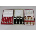 A cased set of six Elizabeth II silver gilt and floral enamel coffee spoons, maker Walker & Hall,