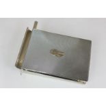 An Asprey George VI silver notebook desk stand, rectangular, with engine turned decoration, hinged