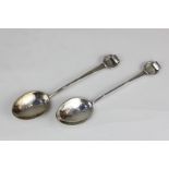 A pair of modern Sottish silver teaspoons with hammered bowls and ring terminals, maker Nellie