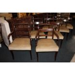 A set of eight 19th century mahogany dining chairs including two carvers, with carved rope top rails