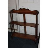 A set of Victorian wall shelves with three serpentine shelves on spindle supports, 65cm